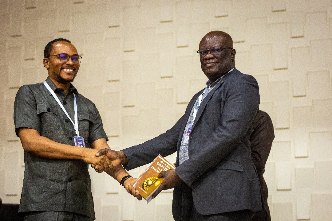 Albert Nii Ayi Tagoe donating copies of his books at a university seminar